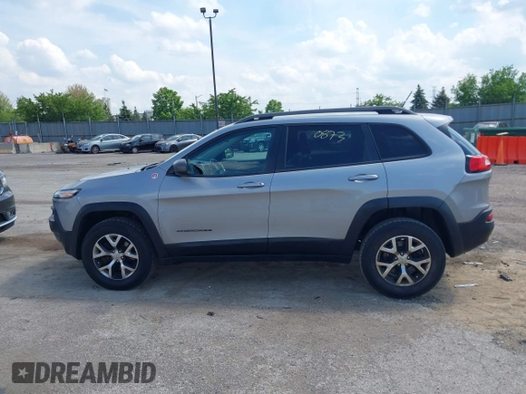 2015 Jeep Cherokee Trailhawk z VIN 1C4PJMBS5FW615313, wystawiony jako IAAI lot #42250873 z przebiegiem 148 008 mil mil oraz . Historia ofert i sprzedaży dostępna na DreamBid. Obrazek 14.