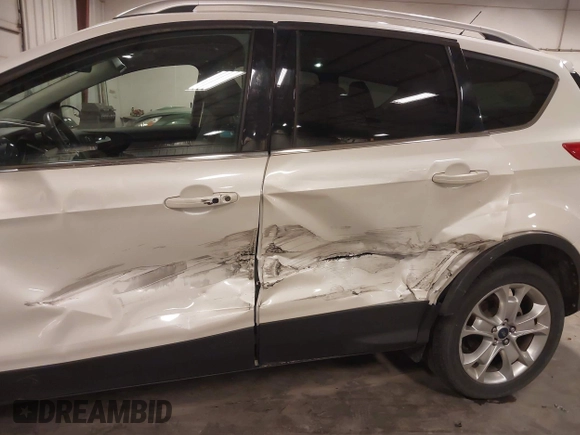 2016 Ford Escape Titanium with VIN 1FMCU9J99GUA61848, listed as a IAAI auction lot 42300324 with 51,692 mi miles and . Bid and sale history available at DreamBid. Image 6.