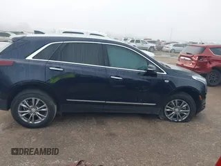 2021 Cadillac XT5 FWD Premium Luxury with VIN 1GYKNCRS2MZ185678, listed as a IAAI auction lot 41143084 with 25,399 mi miles and . Bid and sale history available at carsss.com. Image 13.