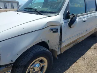 2003 Ford F-150 XLT with VIN 1FTRW07663KD57580, listed as a IAAI auction lot 41870643 with 256,497 mi miles. Bid and sale history available at carsss.com. Image 6.