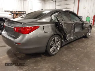2014 Infiniti Q50 Premium with VIN JN1BV7ARXEM699902, listed as a IAAI auction lot 42135410 with 103,929 mi miles and . Bid and sale history available at DreamBid. Image 4.