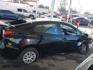 2021 Toyota Prius L Eco with VIN JTDKAMFU2M3134178, listed as a IAAI auction lot 41975477 with 26,936 mi miles. Bid and sale history available at carsss.com. Image 13.