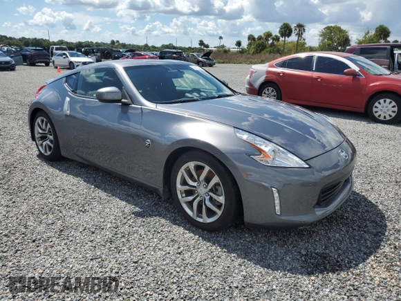 2014 Nissan 370Z with VIN JN1AZ4EH6EM633797, listed as a Copart auction lot 74027354 with Not Provided miles and Salvage Title. Bid and sale history available at DreamBid. Image 4.