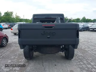 2021 Jeep Gladiator Sport S z VIN 1C6JJTAG9ML604950, wystawiony jako IAAI lot #39912720 z przebiegiem 34 640 mil mil oraz . Historia ofert i sprzedaży dostępna na DreamBid. Obrazek 16.