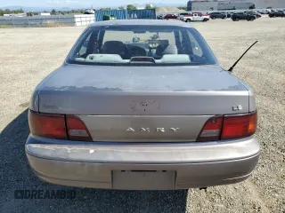 1996 Toyota Camry DX z VIN JT2BG12K7T0419839, wystawiony jako Copart lot #58267425 z przebiegiem 215 456 mil mil oraz Szkoda całkowita • Salvage title. Historia ofert i sprzedaży dostępna na DreamBid. Obrazek 6.