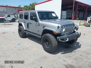 2021 Jeep Wrangler Unlimited Sahara z VIN 1C4HJXEN9MW637288, wystawiony jako IAAI lot #42553459 z przebiegiem 39 362 mil mil oraz . Historia ofert i sprzedaży dostępna na DreamBid. Obrazek 1.