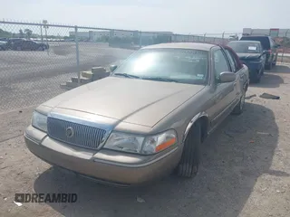 2003 Mercury Grand Marquis GS Convenience z VIN 2MEFM74W33X637135, wystawiony jako IAAI lot #42001834 z przebiegiem 146 184 mil mil oraz . Historia ofert i sprzedaży dostępna na DreamBid. Obrazek 2.