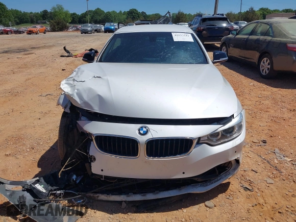 2014 BMW 4 Series 435i z VIN WBA3T3C5XEP737022, wystawiony jako IAAI lot #42135541 z przebiegiem 70 080 mil mil oraz . Historia ofert i sprzedaży dostępna na DreamBid. Obrazek 12.