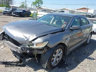 2011 Ford Taurus SEL with VIN 1FAHP2EW5BG189882, listed as a IAAI auction lot 42006542 with 208,661 mi miles. Bid and sale history available at carsss.com. Image 2.
