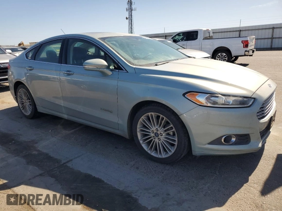 2014 Ford Fusion SE Hybrid with VIN 3FA6P0LUXER164566, listed as a Copart auction lot 64900635 with 181,728 mi miles and Clean title. Bid and sale history available at DreamBid. Image 4.