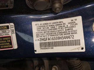 2009 Honda Civic Sdn LX with VIN 2HGFA16559H544472, listed as a IAAI auction lot 41695513 with 124,845 mi miles. Bid and sale history available at carsss.com. Image 9.