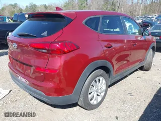 2019 Hyundai Tucson SE with VIN KM8J23A45KU931585, listed as a IAAI auction lot 41797137 with 101,559 mi miles. Bid and sale history available at carsss.com. Image 4.