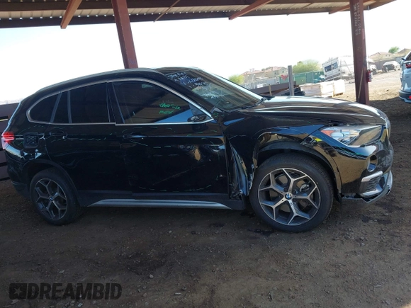 2018 BMW X1 sDrive28i z VIN WBXHU7C35J5L06673, wystawiony jako IAAI lot #42275787 z przebiegiem 61 204 mil mil oraz . Historia ofert i sprzedaży dostępna na DreamBid. Obrazek 13.