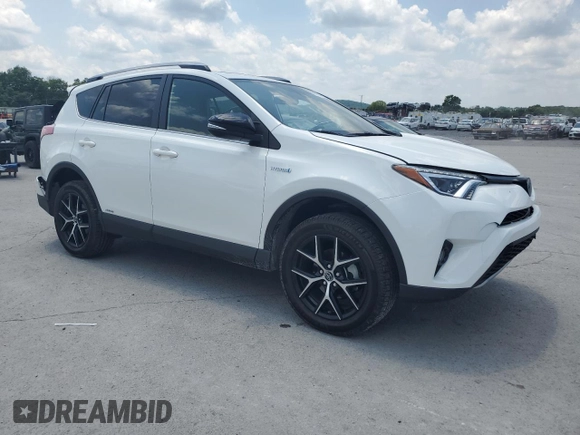 2018 Toyota RAV4 Hybrid SE with VIN JTMJJREVXJD212926, listed as a Copart auction lot 60215465 with 71,876 mi miles and Salvage title. Bid and sale history available at DreamBid. Image 4.