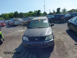 1999 Honda CR-V LX z VIN JHLRD2842XC010409, wystawiony jako IAAI lot #42402281 z przebiegiem 265 901 mil mil oraz . Historia ofert i sprzedaży dostępna na DreamBid. Obrazek 6.