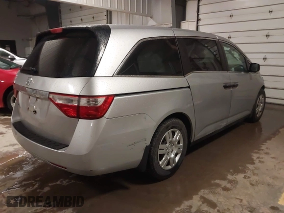 2012 Honda Odyssey LX with VIN 5FNRL5H27CB092988, listed as a IAAI auction lot 41933507 with 123,233 mi miles and . Bid and sale history available at DreamBid. Image 4.