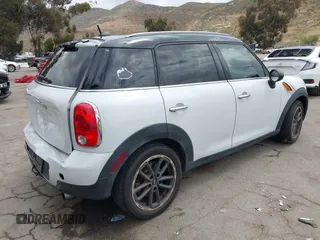 2015 MINI Countryman with VIN WMWZB3C57FWR46707, listed as a IAAI auction lot 42114457 with 137,356 mi miles and . Bid and sale history available at DreamBid. Image 4.