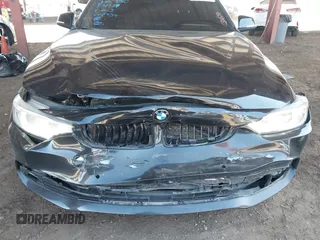 2015 BMW 4 Series 428i with VIN WBA3N3C55FK232613, listed as a IAAI auction lot 41865898 with 104,585 mi miles and . Bid and sale history available at carsss.com. Image 6.