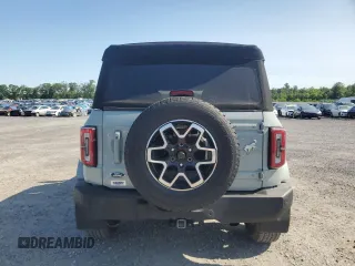 2023 Ford Bronco with VIN 1FMEE5BP0PLC06549, listed as a Copart auction lot 58703305 with 28,051 mi miles and Salvage title. Bid and sale history available at DreamBid. Image 6.