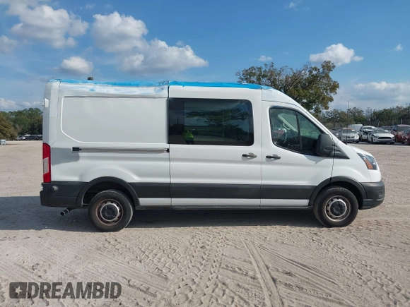 2021 Ford Transit Cargo with VIN 1FTBR1C85MKA19997, listed as a IAAI auction lot 41431285 with 61,158 mi miles and . Bid and sale history available at DreamBid. Image 13.