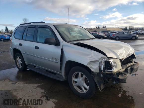 2006 GMC Envoy SLE with VIN 1GKDT13S262327772, listed as a Copart auction lot 85270134 with 242,390 mi miles and Salvage Title. Bid and sale history available at carsss.com. Image 4.