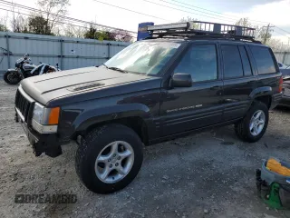 1998 Jeep Grand Cherokee Limited z VIN 1J4GZ88Z2WC151641, wystawiony jako Copart lot #52814955 z przebiegiem 167 505 mil mil oraz Szkoda całkowita • Salvage title. Historia ofert i sprzedaży dostępna na DreamBid. Obrazek 1.