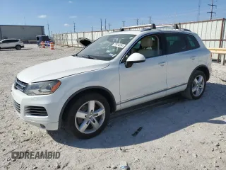 2012 Volkswagen Touareg с VIN WVGEG9BP8CD008064, выставлен на аукционе Copart как лот 77874234 с пробегом 111 413 миль миль и Чистый • Clean title. История ставок и продаж доступна на DreamBid. Изображение 1.