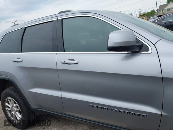 2018 Jeep Grand Cherokee Laredo E with VIN 1C4RJFAG5JC377197, listed as a IAAI auction lot 42432131 with 58,981 mi miles and . Bid and sale history available at DreamBid. Image 13.