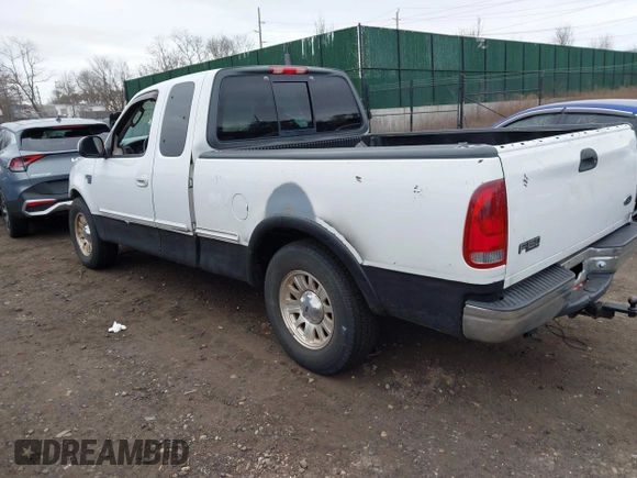 2003 Ford F-150 XL with VIN 1FTRX17W73NA42322, listed as a IAAI auction lot 41680100 with 129,295 mi miles. Bid and sale history available at carsss.com. Image 3.