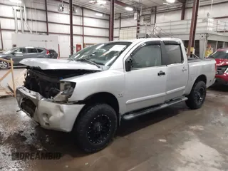 2004 Nissan Titan LE with VIN 1N6AA07B44N512889, listed as a IAAI auction lot 41569019 with 154,655 mi miles. Bid and sale history available at carsss.com. Image 2.