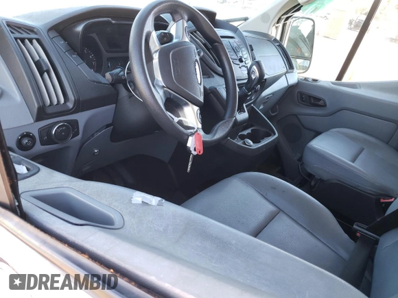 2018 Ford Transit z VIN 1FTYR2CMXJKA73854, wystawiony jako Copart lot #81051414 z przebiegiem Nie podano mil oraz Szkody całkowita. Historia ofert i sprzedaży dostępna na DreamBid. Obrazek 8.
