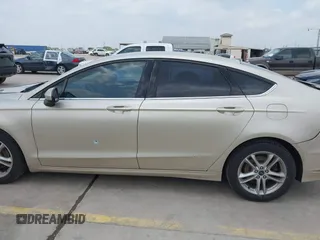 2018 Ford Fusion SE z VIN 3FA6P0H75JR176394, wystawiony jako IAAI lot #42169780 z przebiegiem 65 617 mil mil oraz . Historia ofert i sprzedaży dostępna na DreamBid. Obrazek 14.