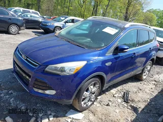 2014 Ford Escape Titanium with VIN 1FMCU0JX2EUB78596, listed as a IAAI auction lot 41994873 with 96,437 mi miles. Bid and sale history available at carsss.com. Image 2.