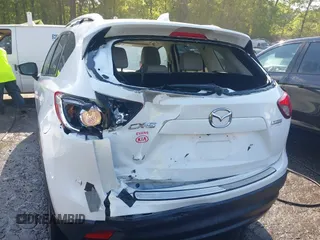 2014 Mazda CX-5 Grand Touring with VIN JM3KE2DY1E0424890, listed as a IAAI auction lot 42052437 with 107,793 mi miles. Bid and sale history available at carsss.com. Image 6.