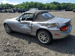 2002 Mazda MX-5 Miata Cloth z VIN JM1NB353520224582, wystawiony jako Copart lot #63669835 z przebiegiem 88 455 mil mil oraz Szkoda całkowita • Salvage title. Historia ofert i sprzedaży dostępna na DreamBid. Obrazek 2.