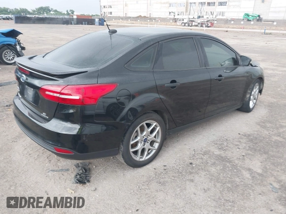2015 Ford Focus SE with VIN 1FADP3F29FL219561, listed as a IAAI auction lot 42470047 with 98,169 mi miles and . Bid and sale history available at DreamBid. Image 4.
