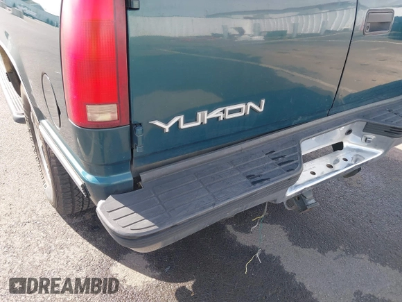 1999 GMC Yukon with VIN 1GKEK13R3XJ717999, listed as a IAAI auction lot 41870187 with 179,855 mi miles. Bid and sale history available at carsss.com. Image 6.