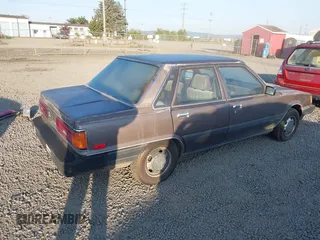 1985 Toyota Camry z VIN JT2SV12EXF0291360, wystawiony jako IAAI lot #42094530 z przebiegiem 426 444 mil mil oraz . Historia ofert i sprzedaży dostępna na DreamBid. Obrazek 4.