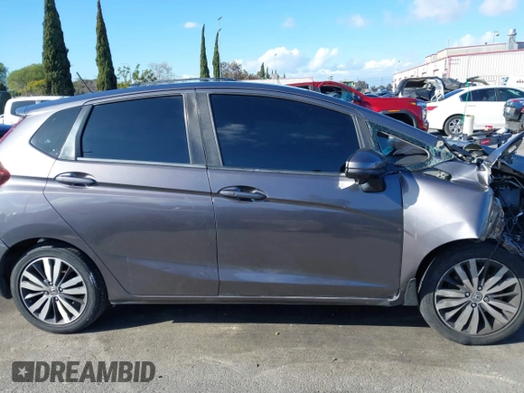 2015 Honda Fit EX-L z VIN 3HGGK5H89FM774299, wystawiony jako IAAI lot #41793448 z przebiegiem 142 228 mil mil oraz . Historia ofert i sprzedaży dostępna na DreamBid. Obrazek 13.