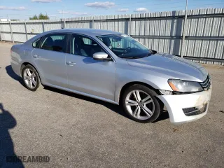 2013 Volkswagen Passat SE with VIN 1VWBP7A37DC106002, listed as a Copart auction lot 83014264 with 215,406 mi miles and Salvage Title. Bid and sale history available at carsss.com. Image 4.
