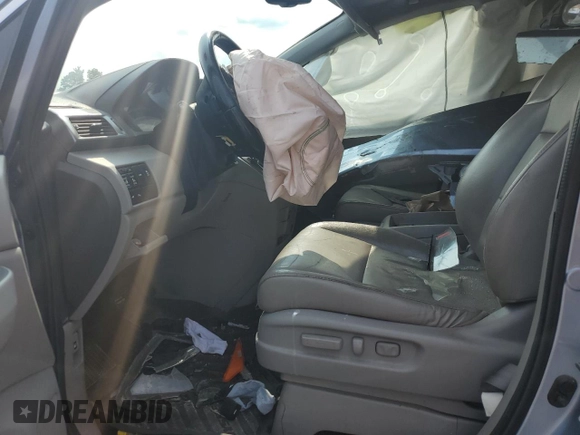 2014 Honda Odyssey Touring with VIN 5FNRL5H95EB080449, listed as a Copart auction lot 58489715 with 154,604 mi miles and Salvage title. Bid and sale history available at DreamBid. Image 7.