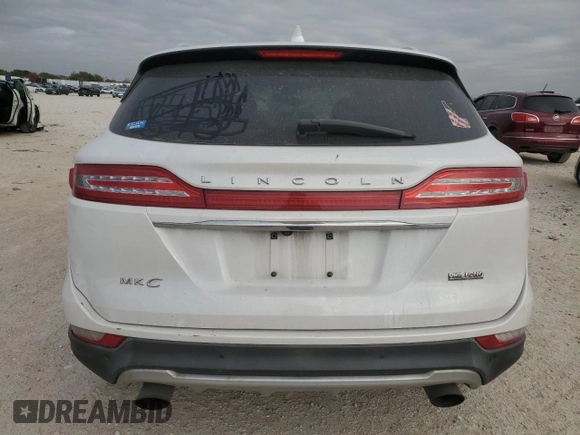 2019 Lincoln MKC Standard with VIN 5LMCJ1D95KUL45392, listed as a Copart auction lot 82561394 with 104,748 mi miles and Salvage Title. Bid and sale history available at DreamBid. Image 6.