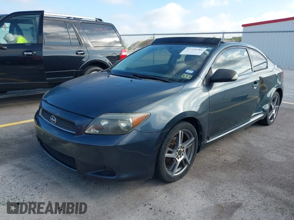 2006 Scion tC with VIN JTKDE167060074288, listed as a IAAI auction lot 37729781 with 119,836 mi miles. Bid and sale history available at carsss.com. Image 2.