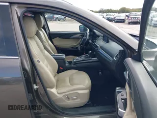 2017 Mazda CX-9 Grand Touring with VIN JM3TCADY7H0133092, listed as a IAAI auction lot 41133652 with 233,454 mi miles and . Bid and sale history available at DreamBid. Image 5.