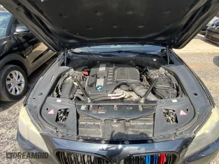 2012 BMW 7 Series 740Li with VIN WBAKB4C55CC576166, listed as a Copart auction lot 52448115 with 154,949 mi miles and Clean Title. Bid and sale history available at carsss.com. Image 7.