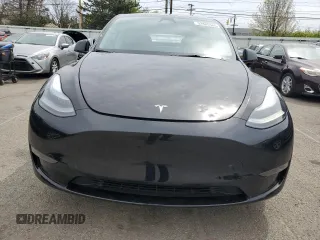 2023 Tesla Model Y Long Range z VIN 7SAYGDEE0PF869710, wystawiony jako Copart lot #52885365 z przebiegiem 13 919 mil mil oraz Szkoda całkowita • Salvage title. Historia ofert i sprzedaży dostępna na DreamBid. Obrazek 5.