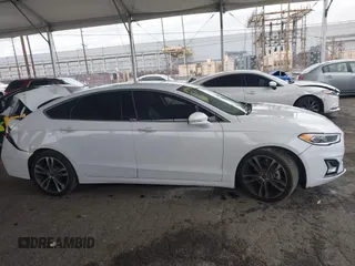 2019 Ford Fusion Titanium with VIN 3FA6P0K90KR236674, listed as a IAAI auction lot 42008633 with 99,737 mi miles and . Bid and sale history available at DreamBid. Image 13.