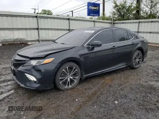 2018 Toyota Camry LE с VIN 4T1B11HK6JU089323, выставлен на аукционе Copart как лот 56353395 с пробегом 108 900 миль миль и Списание • Salvage title. История ставок и продаж доступна на DreamBid. Изображение 1.