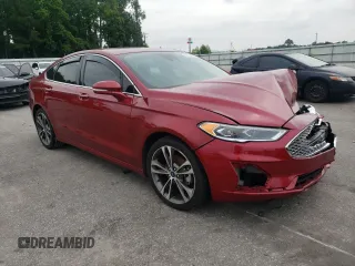 2019 Ford Fusion Titanium z VIN 3FA6P0D99KR221328, wystawiony jako Copart lot #57104515 z przebiegiem 138 427 mil mil oraz Szkoda całkowita • Salvage title. Historia ofert i sprzedaży dostępna na DreamBid. Obrazek 4.
