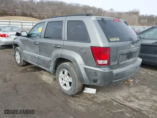 2007 Jeep Grand Cherokee Laredo with VIN 1J8GR48K57C556517, listed as a IAAI auction lot 41534166 with 158,914 mi miles. Bid and sale history available at carsss.com. Image 3.